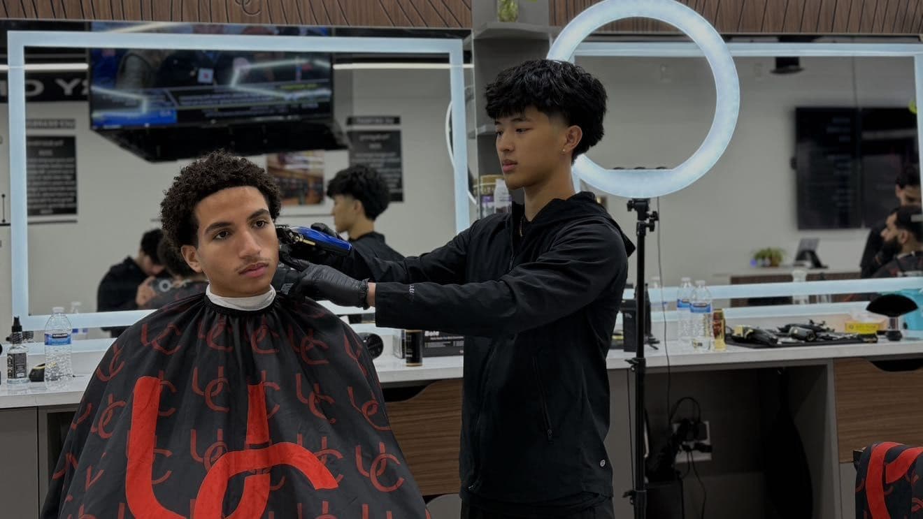 Chung cutting a client's hair at Onyx Barber Co. in Canton